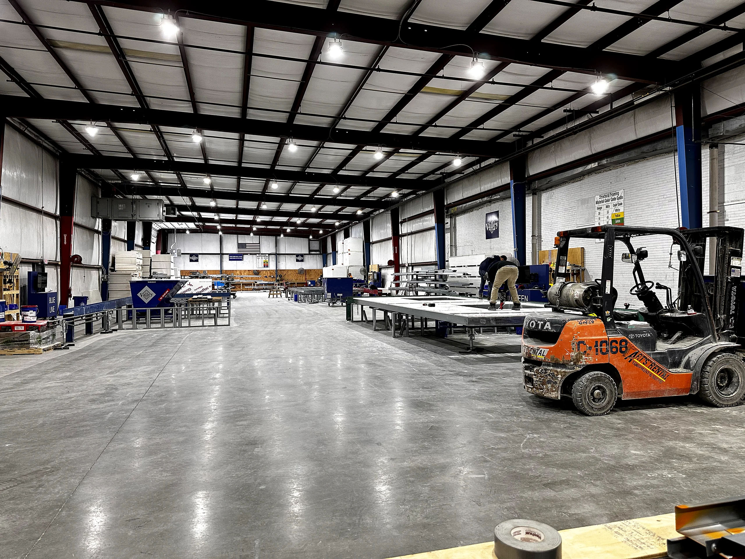 Assembly tables and a forklift on the Valley Interior Systems panel floor